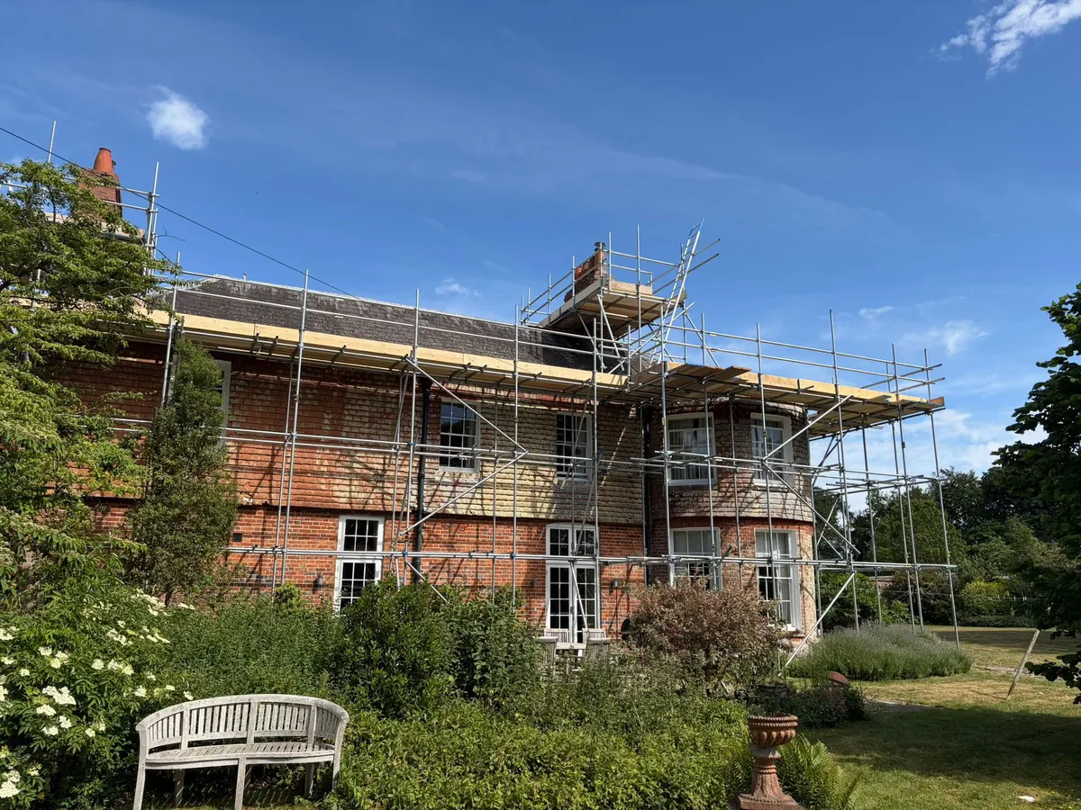 Long run along a brick house from the garden
