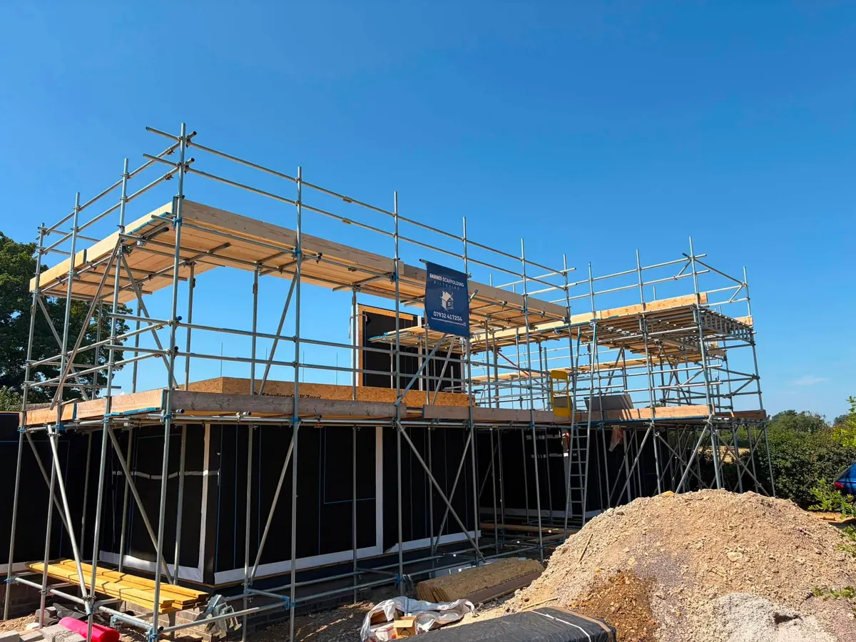 Scaffold with loading bay around a new build