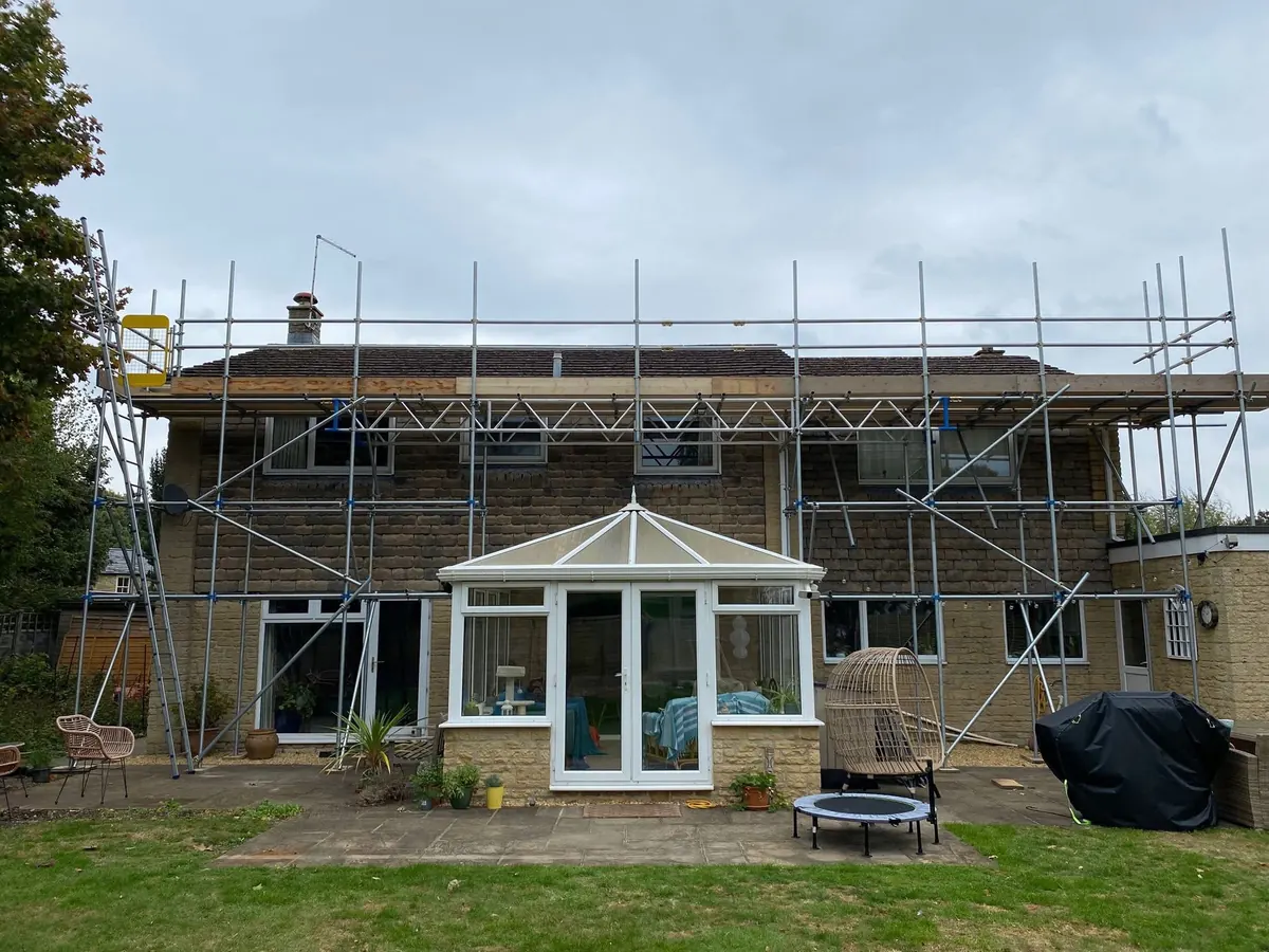 Rear scaffold over a conservatory for roof works